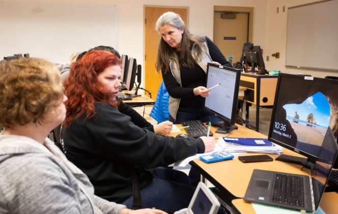 Running Start students working with their professor. Found on thurstontalk.com, courtesy of SPSCC.
